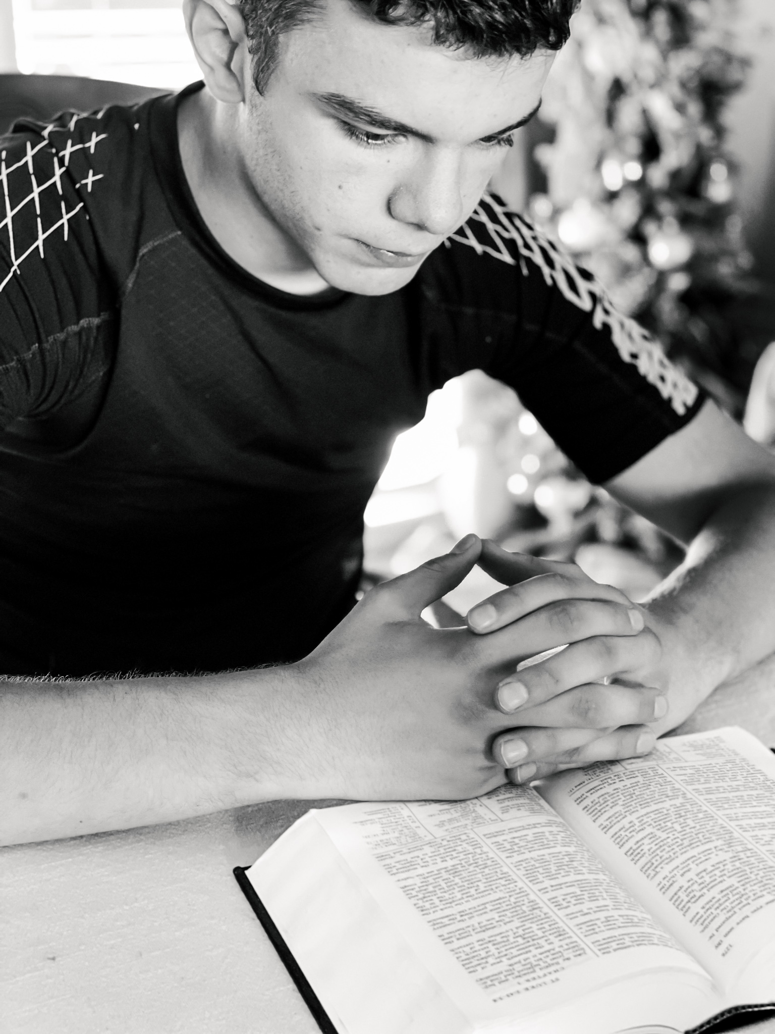 teenage-boy-hands-folded-reading-bible-bible-st-2022-01-13-16-15-12-utc